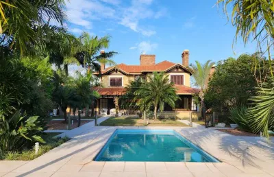 Casa em condomínio fechado com 3 quartos à venda na avenida juca batista, 800, belém novo, porto alegre, 263 m2 por r$ 2.750.000