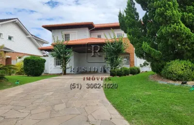 Casa em condomínio fechado com 4 quartos à venda na avenida juca batista, 8000, belém novo, porto alegre, 598 m2 por r$ 2.890.000