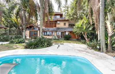 Casa com 4 quartos para alugar na avenida coronel marcos, 899, pedra redonda, porto alegre, 394 m2 por r$ 19.500