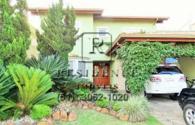 Casa em condomínio fechado com 4 quartos à venda na avenida juca batista, 8000, belém novo, porto alegre, 386 m2 por r$ 2.700.000