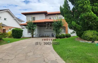 Casa em condomínio fechado com 4 quartos para alugar na avenida juca batista, 8000, belém novo, porto alegre, 598 m2 por r$ 22.000