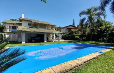 Casa em condomínio fechado com 3 quartos à venda na Avenida Firmino Octávio Bimbi, 255, Cavalhada, Porto Alegre