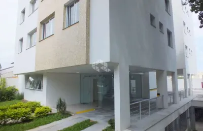 Dois dormitórios com suite duas vagas em frente a praça