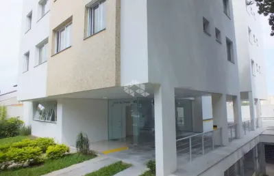 Dois dormitórios com suite duas vagas em frente a praça