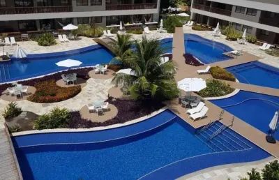 Excelente apartamento duplex 2 quartos, varanda e totalmente mobiliado em muro alto