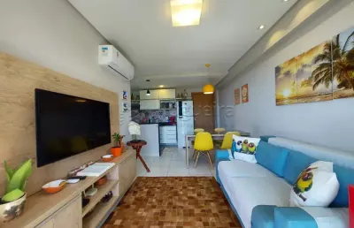 Excelente apartamento mobiliado, em condomínio beira mar, com 65,00m² de área útil.