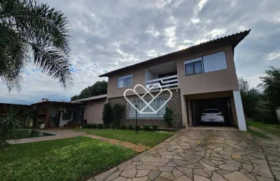 Casa ampla com piscina, salão de festas e 4 dormitórios em neópolis – conforto e lazer em gravataí