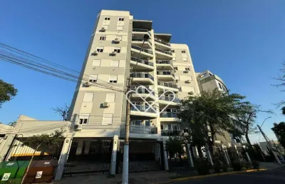 Apartamento sofisticado no centro com sacada, móveis planejados e infraestrutura moderna