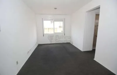 Aluga-se apartamento de 2 dormitórios no edifício residencial comodoro - conforto e praticidade no centro de pelotas
