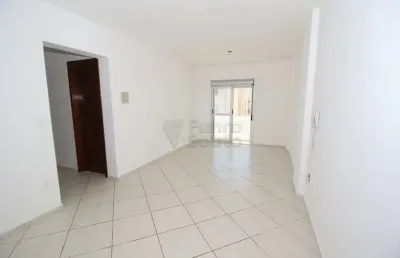 Apartamento espaçoso com 2 dormitórios sendo um suíte e móveis planejados na cozinha