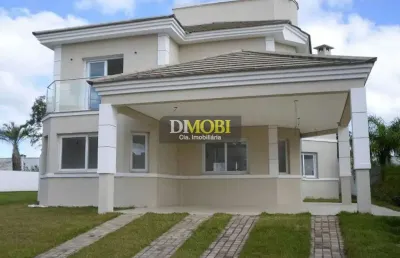 Sobrado com 3 dormitórios à venda, 220 m² por r$ 2.200.000,00 - alphaville - gravataí/rs