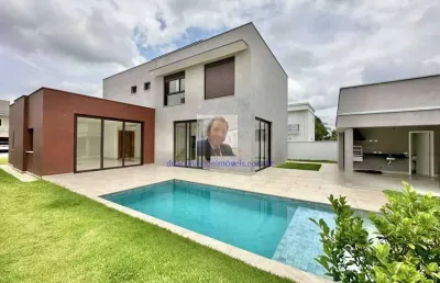 Vende-se casa no cond. alphaville granja vianna - zero km! 4 suíte, piscina