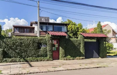 Casa à venda em porto alegre, guarujá, com 3 quartos, 235m²