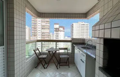 Apartamento mobiliado amplo 1 dormitório suite andar alto com sacada com churrasqueira a carvão  e vista parcial para o mar, a 300m da praia!