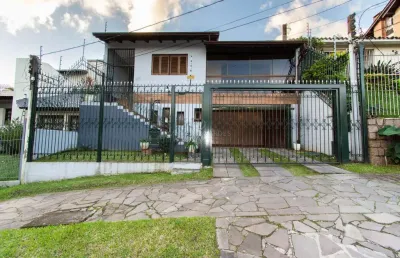 Casa com 3 quartos à venda na rua doutor egydio michaelsen, --, cavalhada, porto alegre por r$ 980.000