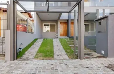 Casa com 3 quartos à venda na rua itacyr rossi, --, guarujá, porto alegre por r$ 560.000