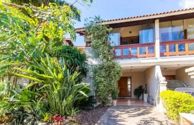 Casa em condomínio fechado com 3 quartos à venda na avenida eduardo prado, --, cavalhada, porto alegre por r$ 960.000