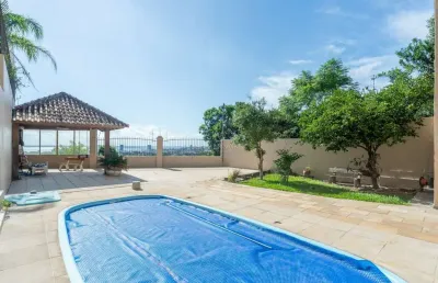 Casa com 4 quartos à venda na rua alcebíades antônio dos santos, --, nonoai, porto alegre por r$ 1.900.000