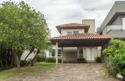 Casa em condomínio fechado com 3 quartos à venda na avenida juca batista, --, belém novo, porto alegre por r$ 1.685.000