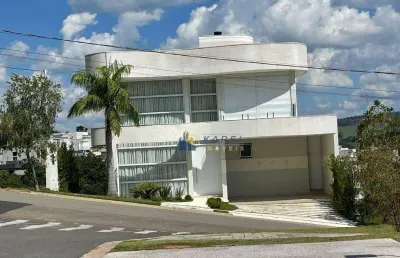 Sobrado á venda com 4 suítes, piscina com borda infinita, vista permanente, sem vizinhos de fundos no condomínio tipo clube vale das águas!!