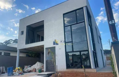 Sobrado em construção com 4 suítes com closet, quintal gramado com piscina para venda no condomínio vale das águas!