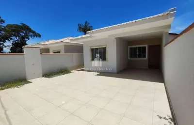 Casa nova com 03 dormitórios (01 suíte) á 400 metros da praia
