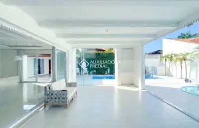 Casa com 5 quartos à venda na avenida dos búzios, 2660, jurerê internacional, florianópolis, 485 m2 por r$ 7.850.000