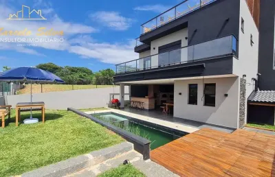 Estilo  rústica moderna, casa 4 dormitórios ,   condomínio alto padrão com sistema clube