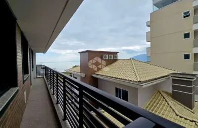 Apartamento com 2 dormitorios churrasqueira e sacada em praia de fora palhoça