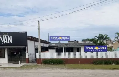 Imóvel comercial (salão mais sala comercial com casa de frente para a rodovia)