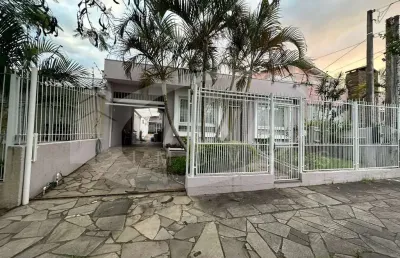 Casa com 3 quartos à venda na avenida rachel wolfrid, 65, alto petrópolis, porto alegre por r$ 699.000