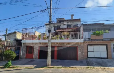 Casa com 4 quartos à venda na rua arnaldo ballve, 709, jardim itu sabará, porto alegre por r$ 1.080.000