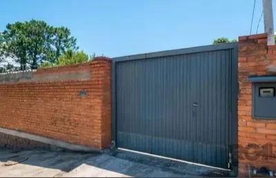 Casa com 3 quartos à venda na Rua Oswaldo Olmiro Machado, Ipanema, Porto Alegre