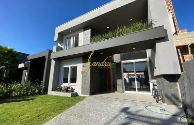 Excelente sobrado em condomínio com 04 suítes  beira lago
