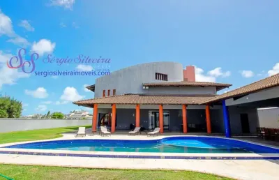 Luxuosa casa no bairro dunas com 5 suítes e vista para o mar.