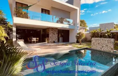 Exclusiva e luxuosa casa no condomínio azur com 4 suítes