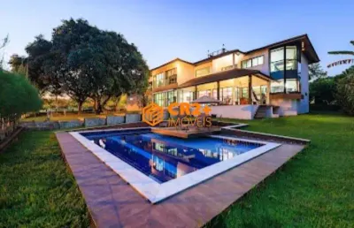 Casa em condomínio com 580m² com 4 suítes, mais acomodação p/hospedes, p/venda o