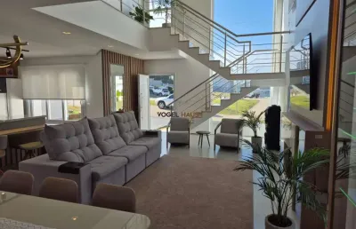 Casa em condomínio fechado reservas do lago, em nova santa rita.