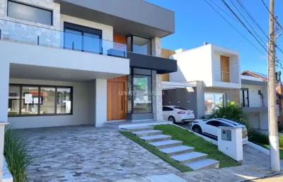 Luxuosa casa em condomínio à venda em porto alegre-rs, bairro hípica. 3 quartos, 3 suítes, 3 salas, 4 banheiros, 2 vagas de garagem, 200m².