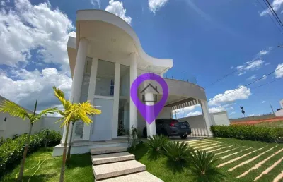 Casa de 250m² à venda no condomínio las palmas em pouso alegre. 3 suítes com varanda, piscina com hidromassagem e arquitetura moderna