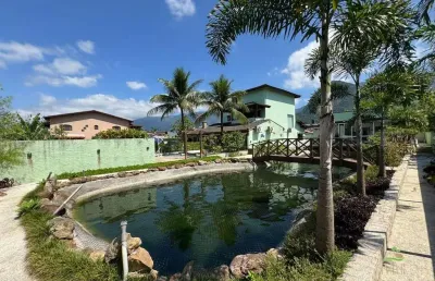 Casa em condomínio: 6 quartos, 2 suítes  morada da praia, bertioga/sp  área de 305,00 m²  4 vagas  jardim e lago