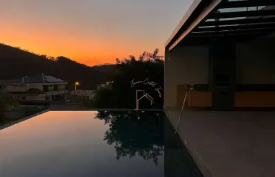 Casa com 5 dormitórios, 540 m² - venda por r$ 4.000.000 ou aluguel por r$ 18.000/mês - condomínio reserva ibirapitanga - santa isabel/sp