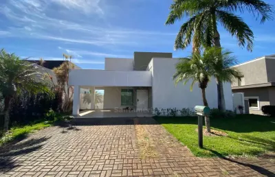 Casa para locação no condomínio fechado sun lake com 4 suítes e cozinha planejada