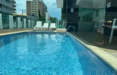 Apartamento a venda na praia grande, bairro caiçara com 2 quartos 1 suite e 1 vaga.