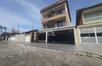 Sobrado em condomínio á venda em vila mirim,  praia grande com 2 quartos e 1 vaga