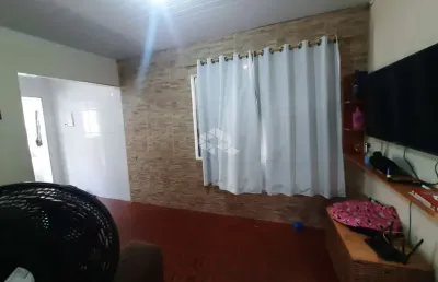 Casa a venda na praia grande, bairro solemar, com 1 quarto e 1 vaga