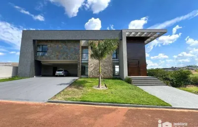 Casa com 4 dormitórios à venda, 553 m² por r$ 3.890.000,00 - condomínio costa do sol - rolândia/pr
