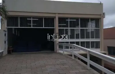 Nbox cia imobiliária vende em bento gonçalves - prédio com duas salas comerciais e dois apartamentos, todos locados no bairro licorsul.
