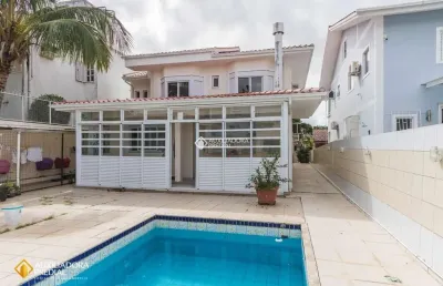 Casa com 4 quartos à venda na avenida deputado protógenes vieira, 72, santa mônica, florianópolis, 238 m2 por r$ 1.800.000