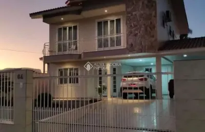 Casa com 3 quartos à venda na rua graciliano carlos de quadros, 164, centro, palhoça, 209 m2 por r$ 1.070.000